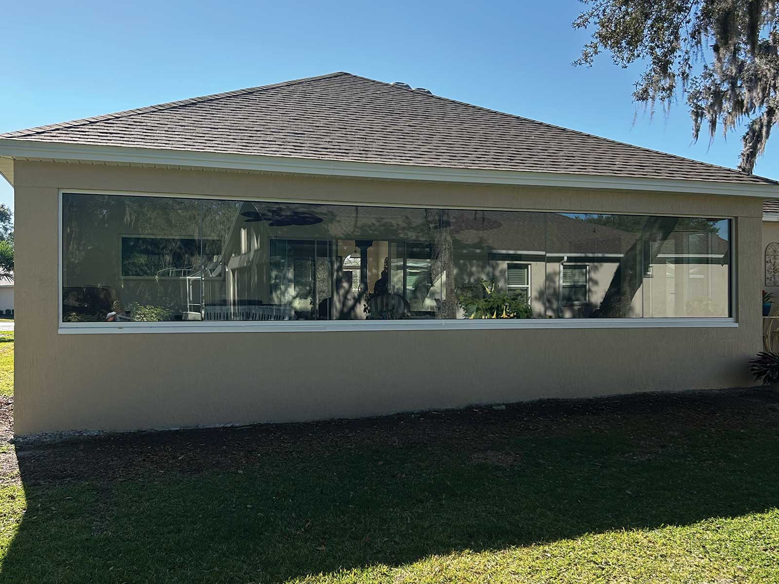 Room addition with matching stucco and roofline in The Villages, Florida by DNJ Construction
