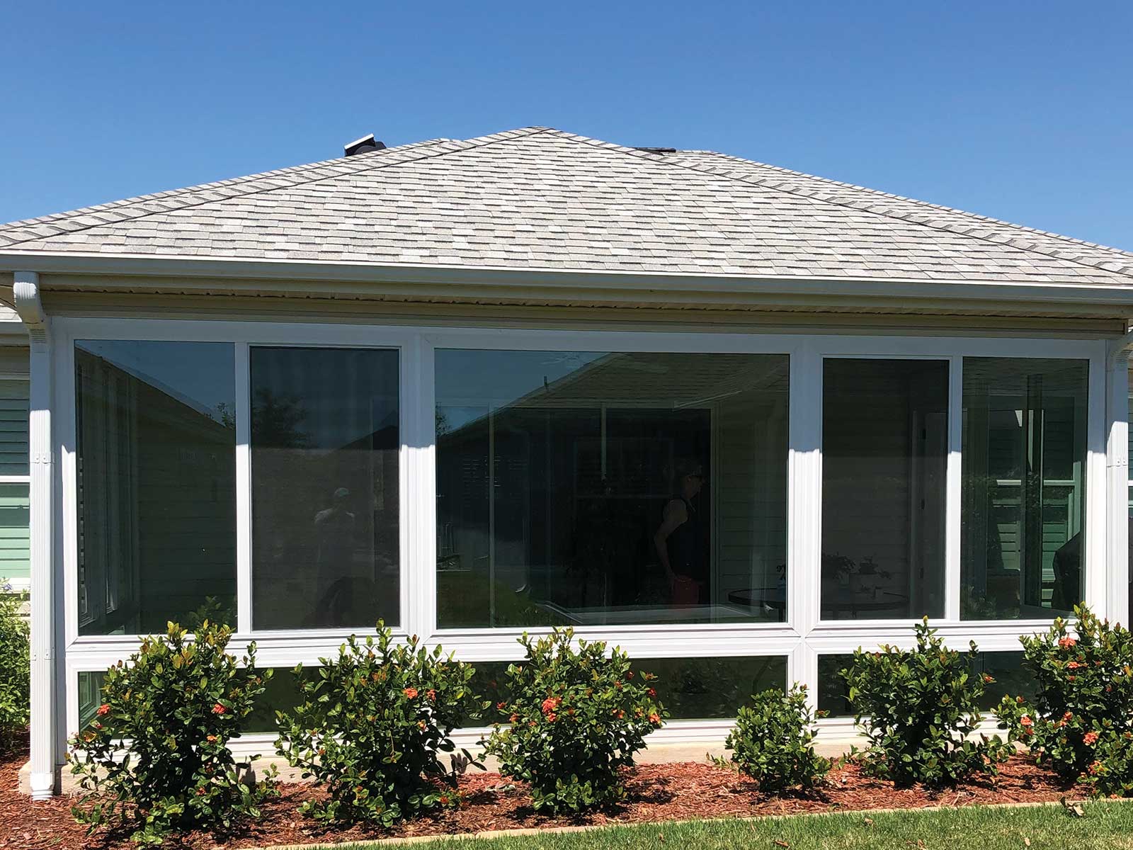 Insulated glass lanai enclosure with landscaped exterior, DNJ Construction