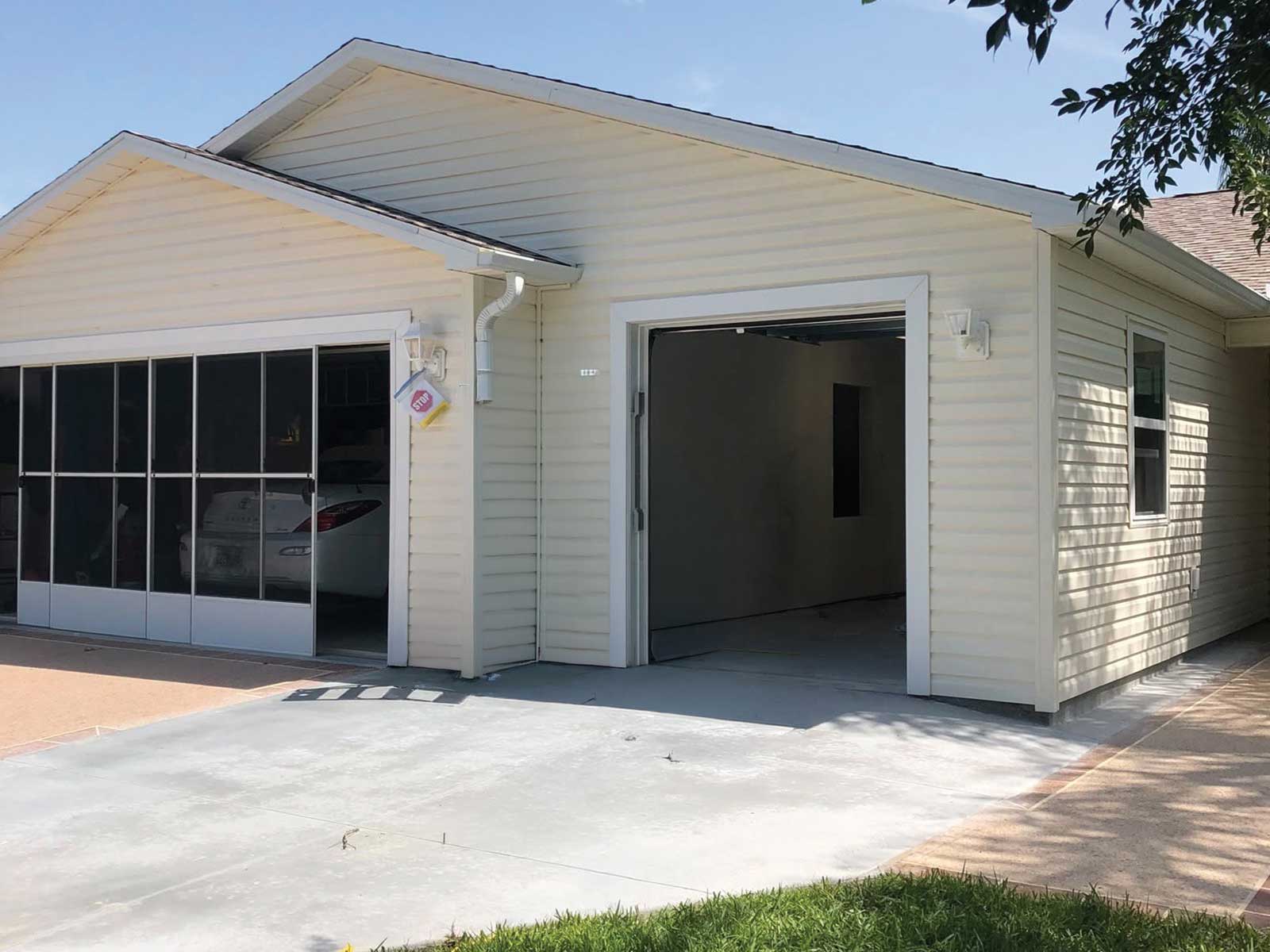 Garage addition with an adjoining screened carport, DNJ Construction