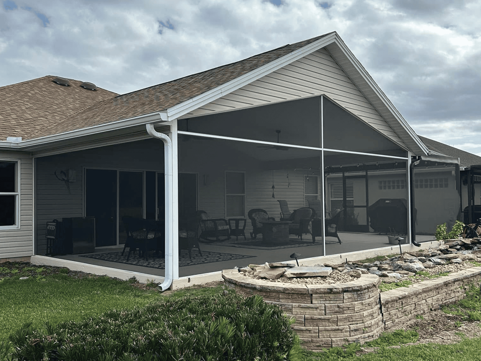 Screened porch addition with a matching gable roofline, DNJ Construction