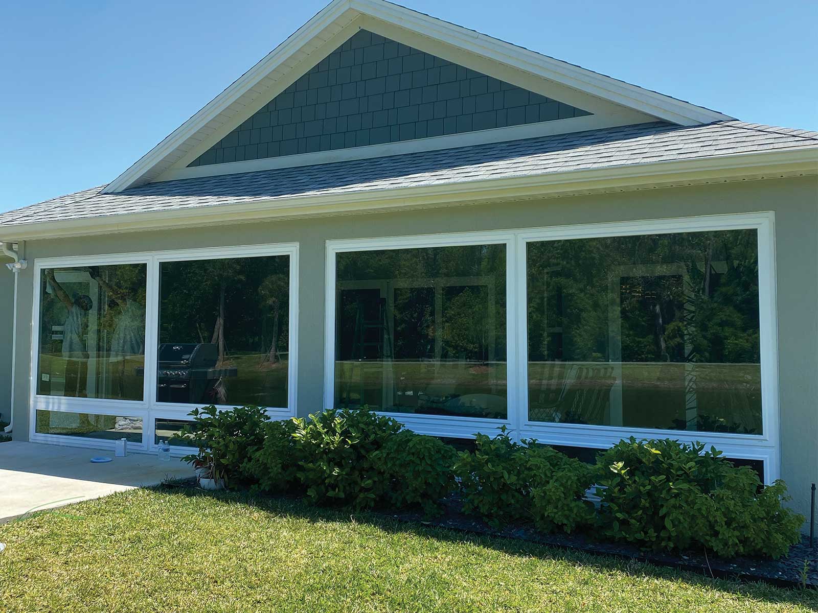 Insulated glass lanai enclosure with a gable roof accent, DNJ Construction