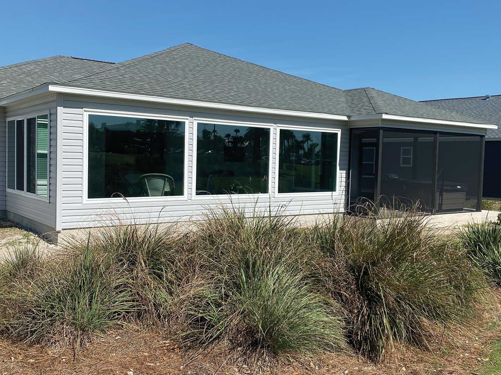 Room addition with a covered screened patio, DNJ Construction